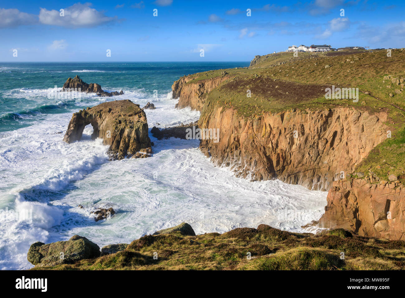 The Enys Dodman natural sea arch at Land's End captured from Pordenack Point. Stock Photo