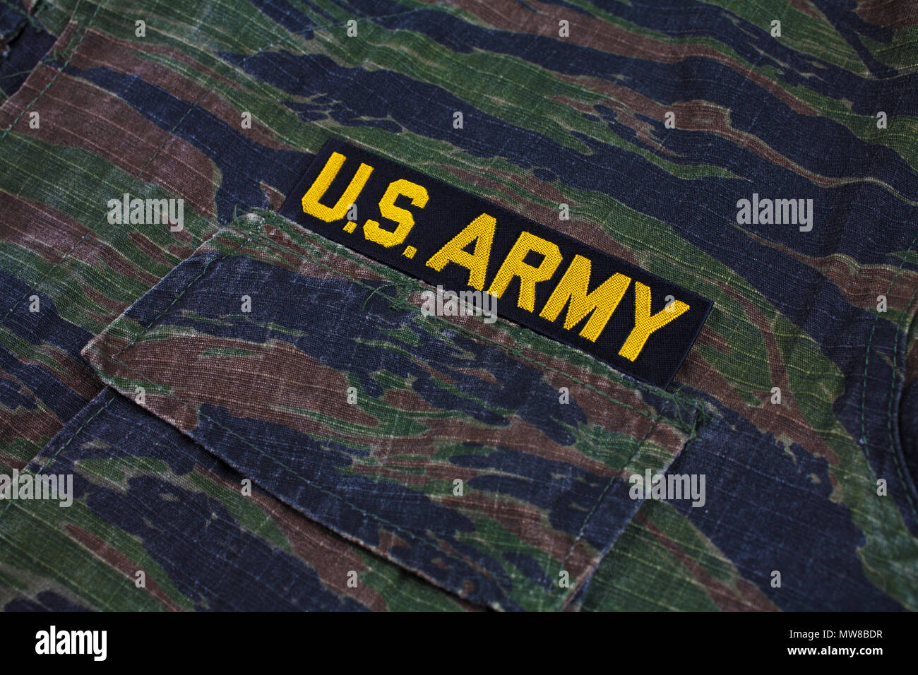 KIEV, UKRAINE - Sept 12, 2016. US ARMY branch tape on tiger stripe camouflage uniform Stock Photo