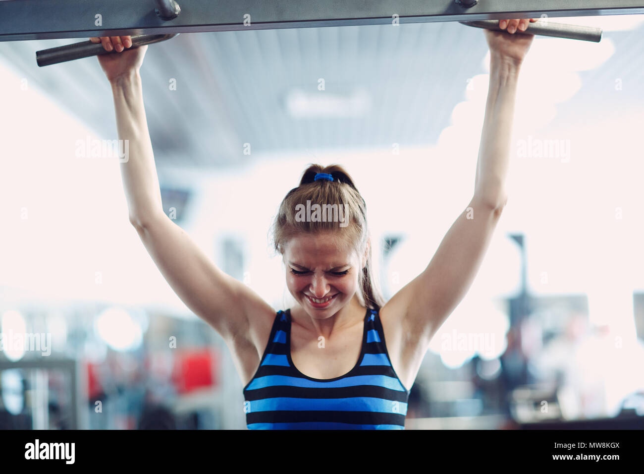 Woman doing pull ups gym hi-res stock photography and images - Page 2 -  Alamy