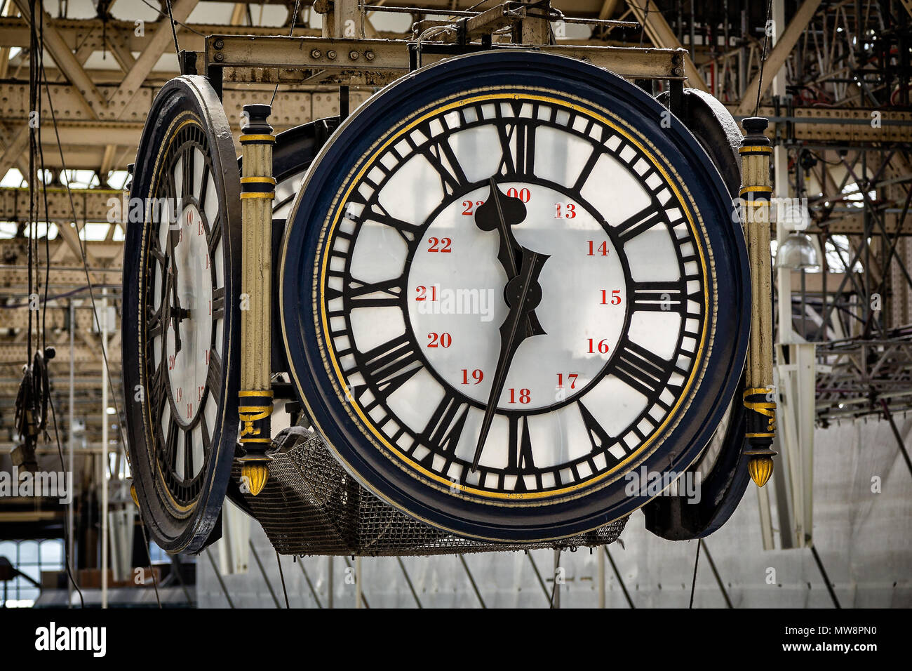 Close up of large hanging 4 sided clock face in Waterloo Station, London, UK taken on 13 August 2013 Stock Photo
