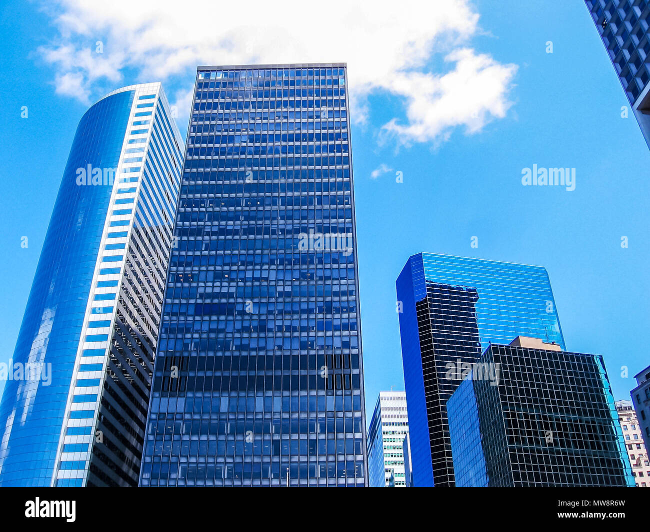Vertical of modern shiny blue facade of high rise buildings in ...