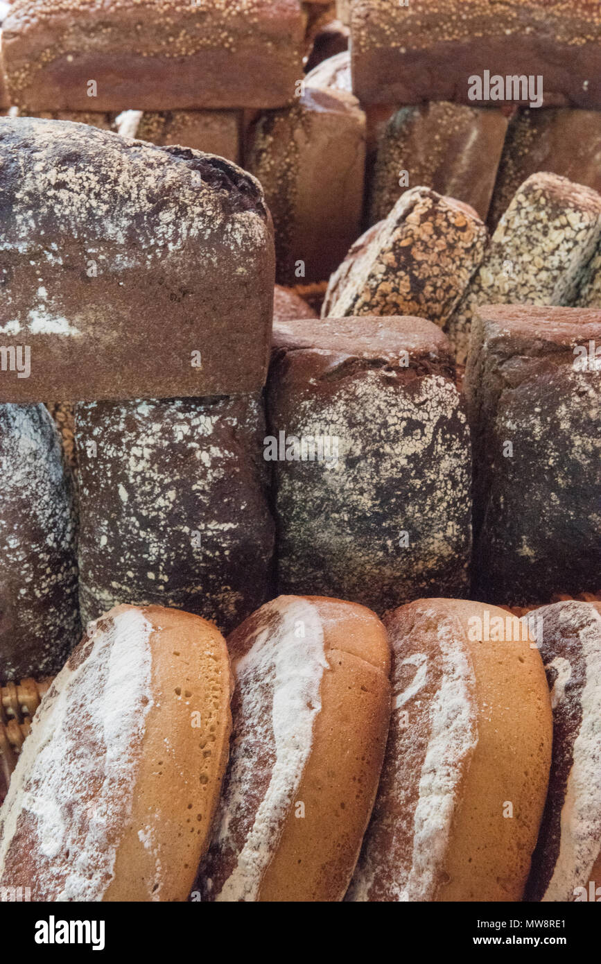freshly baked artisan bakers loaves of breads. Stock Photo