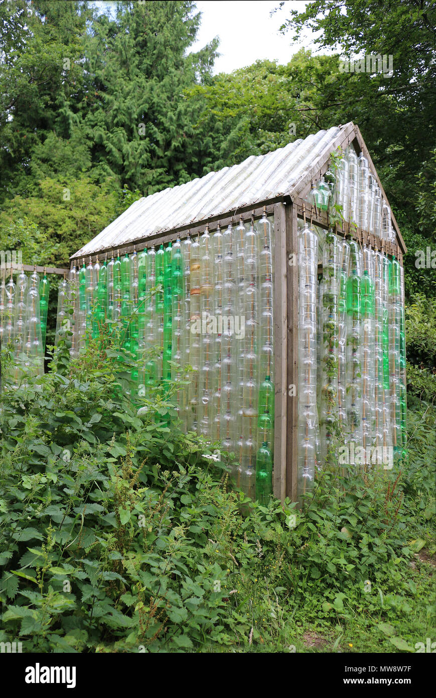 Greenhouse made of old plastic bottles Stock Photo
