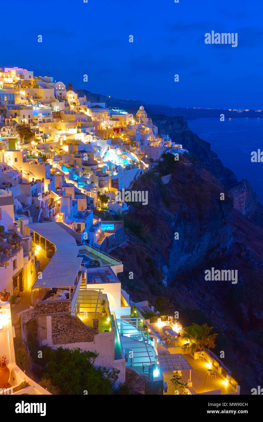 Illuminated Thira town in Santorini Island at night,  Greece Stock Photo