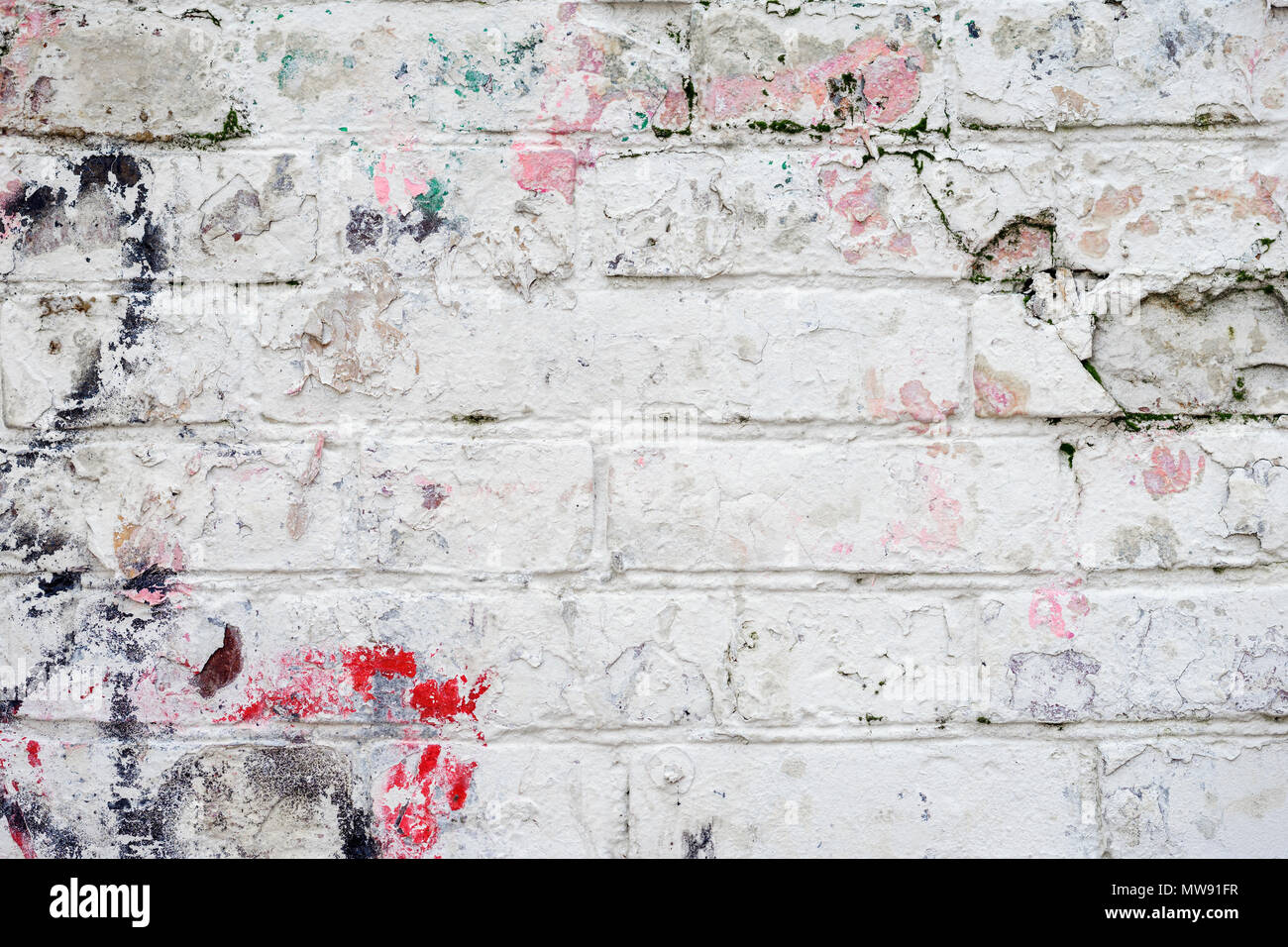 Light dirty painted brick surface closeup, pink paint. Colorful grunge