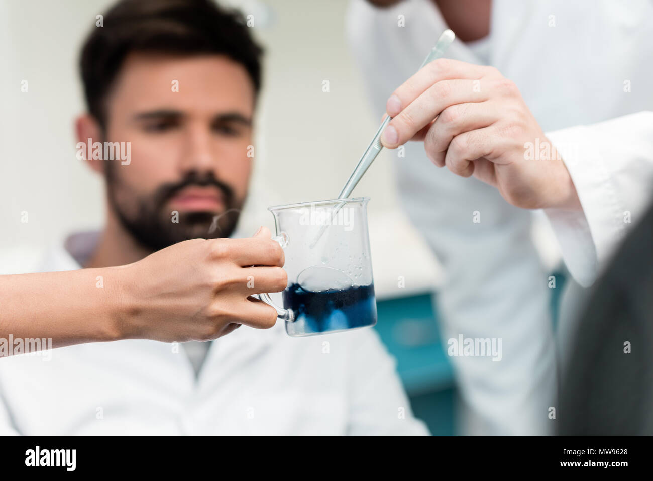 Closeup view of scientists making experiment with reagent and pipette Stock Photo Alamy