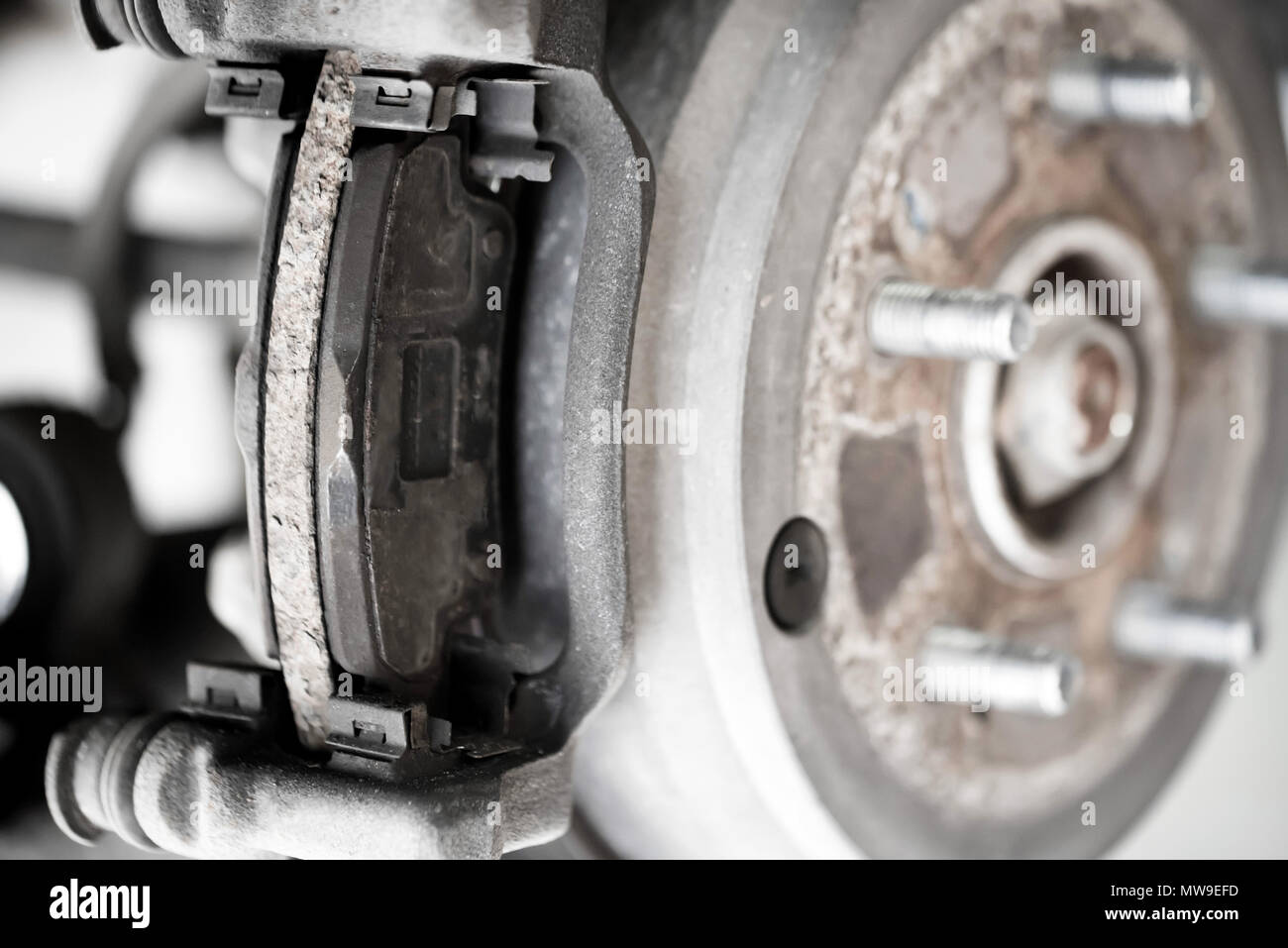 Wheel hub, brake rotor and pad on modern car close Stock Photo