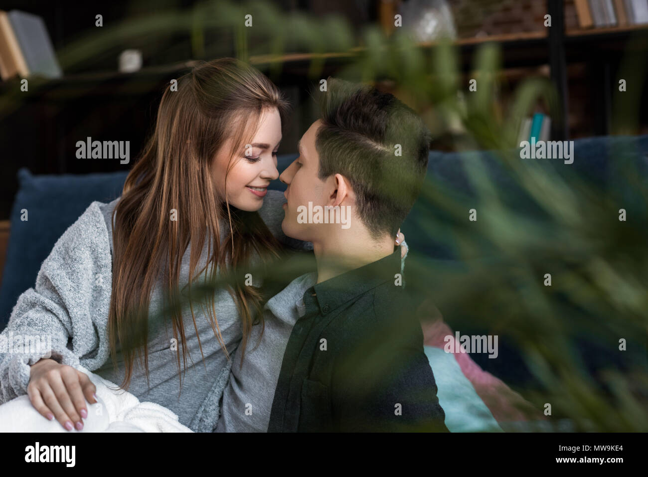 couple going to kiss in bed in morning Stock Photo Alamy