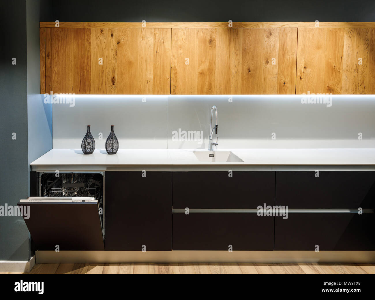 Interior of modern kitchen with white counter Stock Photo - Alamy