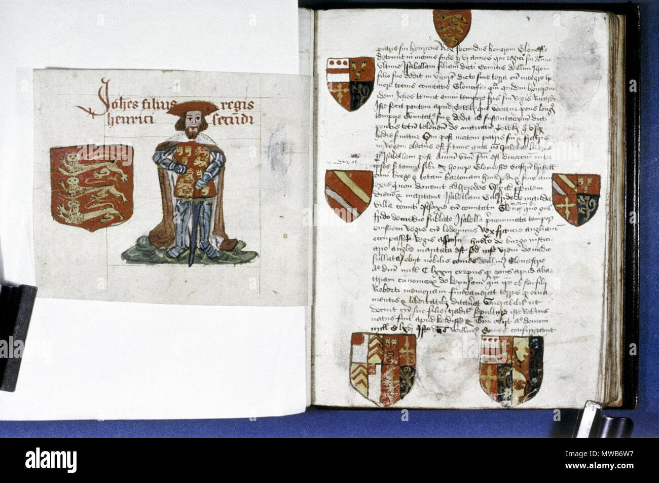 . English: Founders and Benefactors Book of Tewkesbury Abbey: John (1199-1216), nicknamed ‘Lack land’ by his father Henry II, wears a red bonnet and a mantle trimmed with ermine over his heraldic surcoat, his sheathed sword hangs before him. One shield of three lions passant guardant. Fol. 17r Text page with six shields and two obliterated. circa 1525. Unknown 213 Founders Book of Tewkesbury Abbey, Frame 8 Stock Photo
