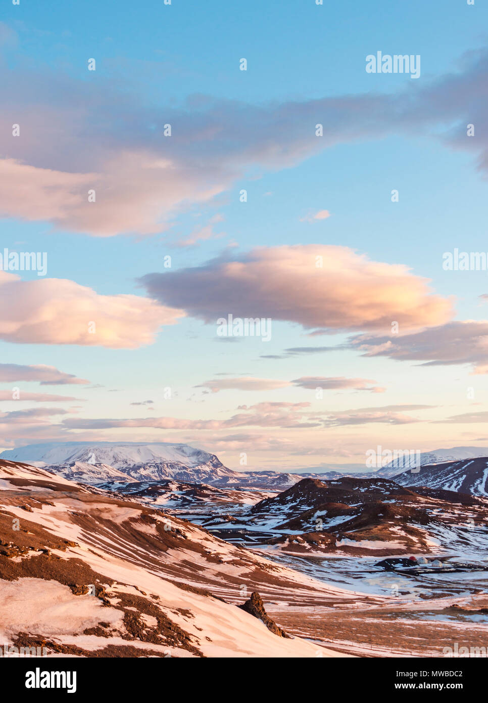 Evening atmosphere, wide volcanic landscape with snow, Icelandic Highland, near Mývatn, in the back volcano Krafla Stock Photo