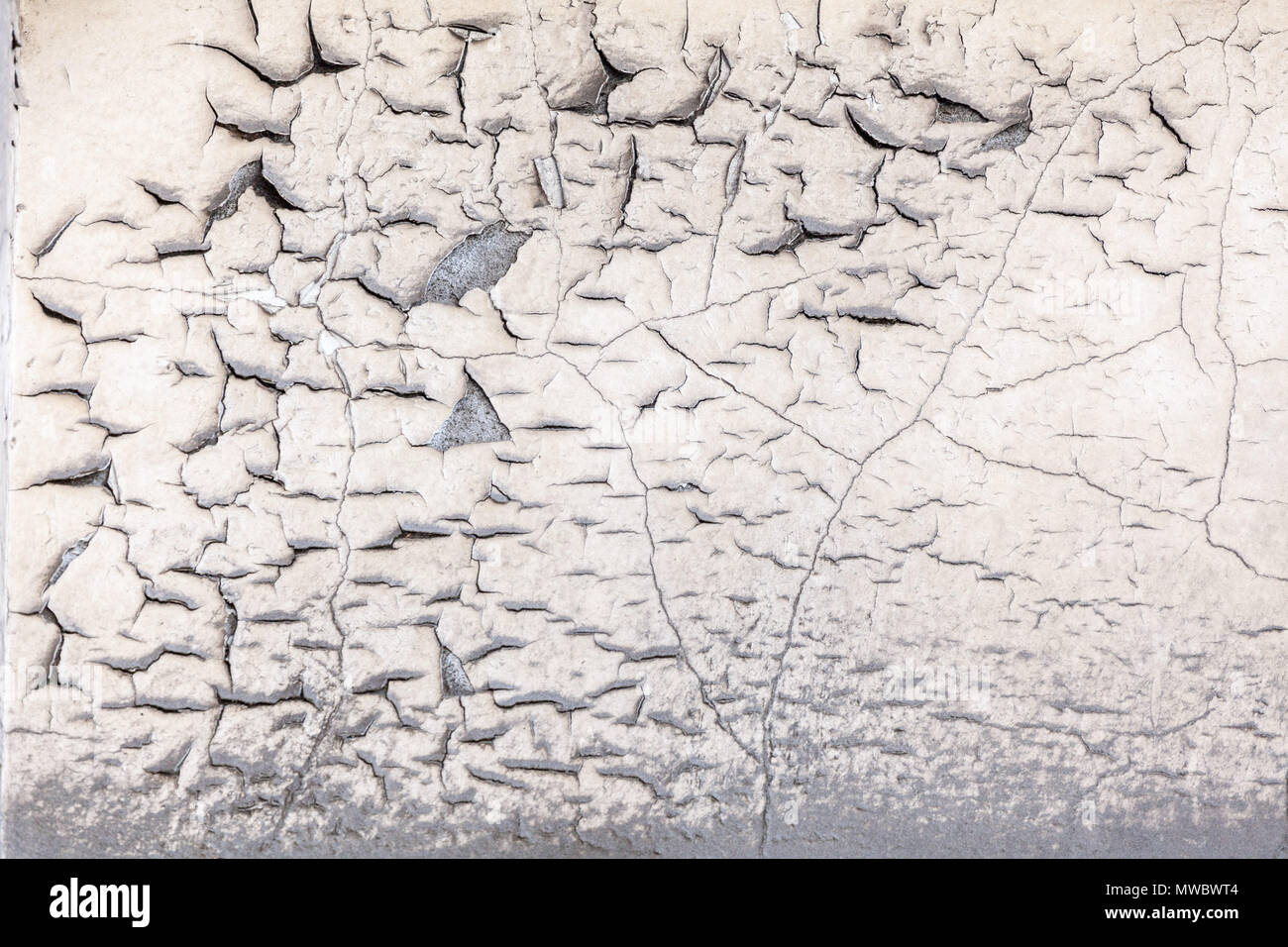 Cracking and peeling paint of concrete wall texture background Stock Photo