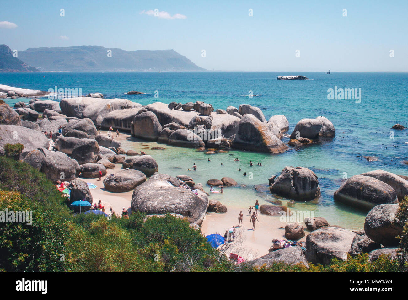 Boulders Beach in Cape Town is a swimming area surrounded by granite boulders.  Also known for the African penguins that frequent the cove. Stock Photo