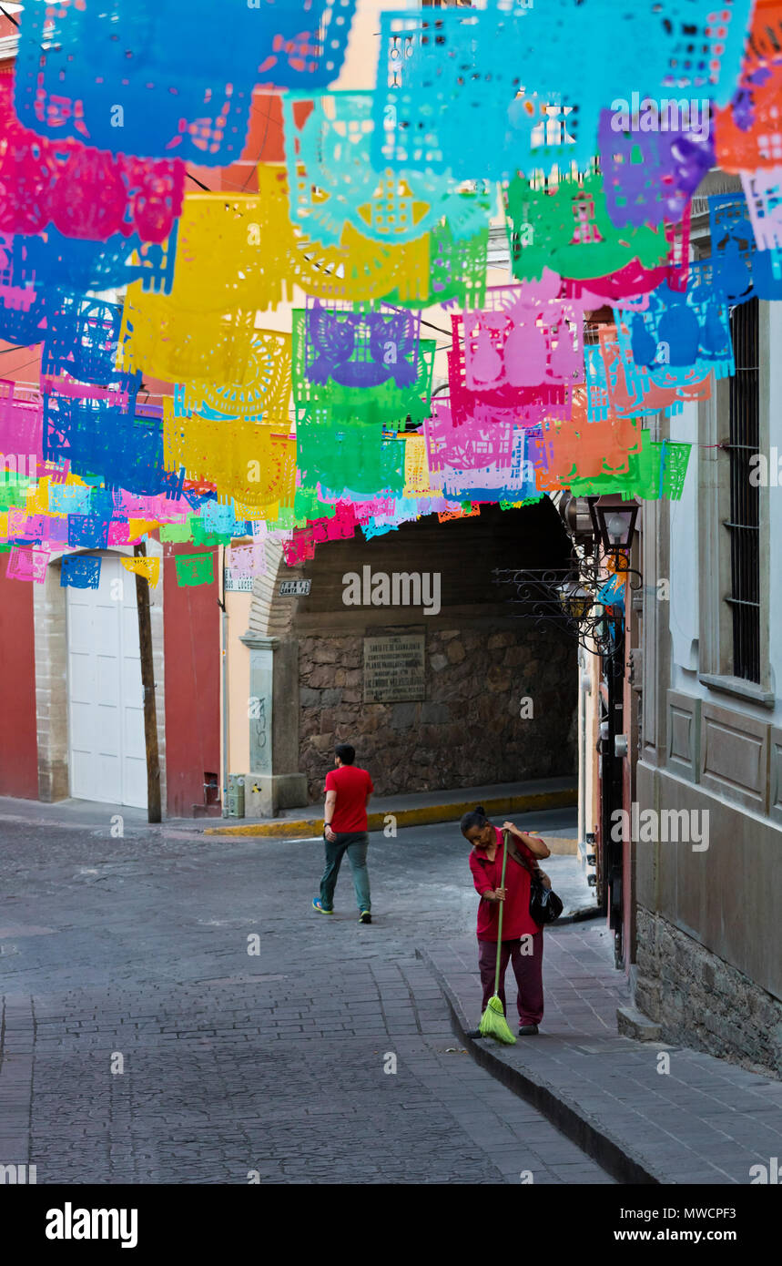 Paper cutout flags decorate the streets during EASTER WEEK - GUANAJUATO, MEXICO Stock Photo