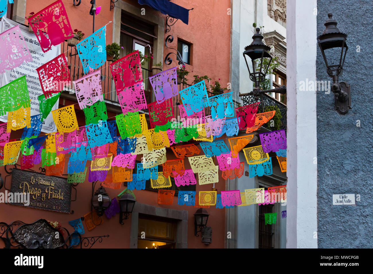 Paper cutout flags decorate the streets during EASTER WEEK - GUANAJUATO, MEXICO Stock Photo