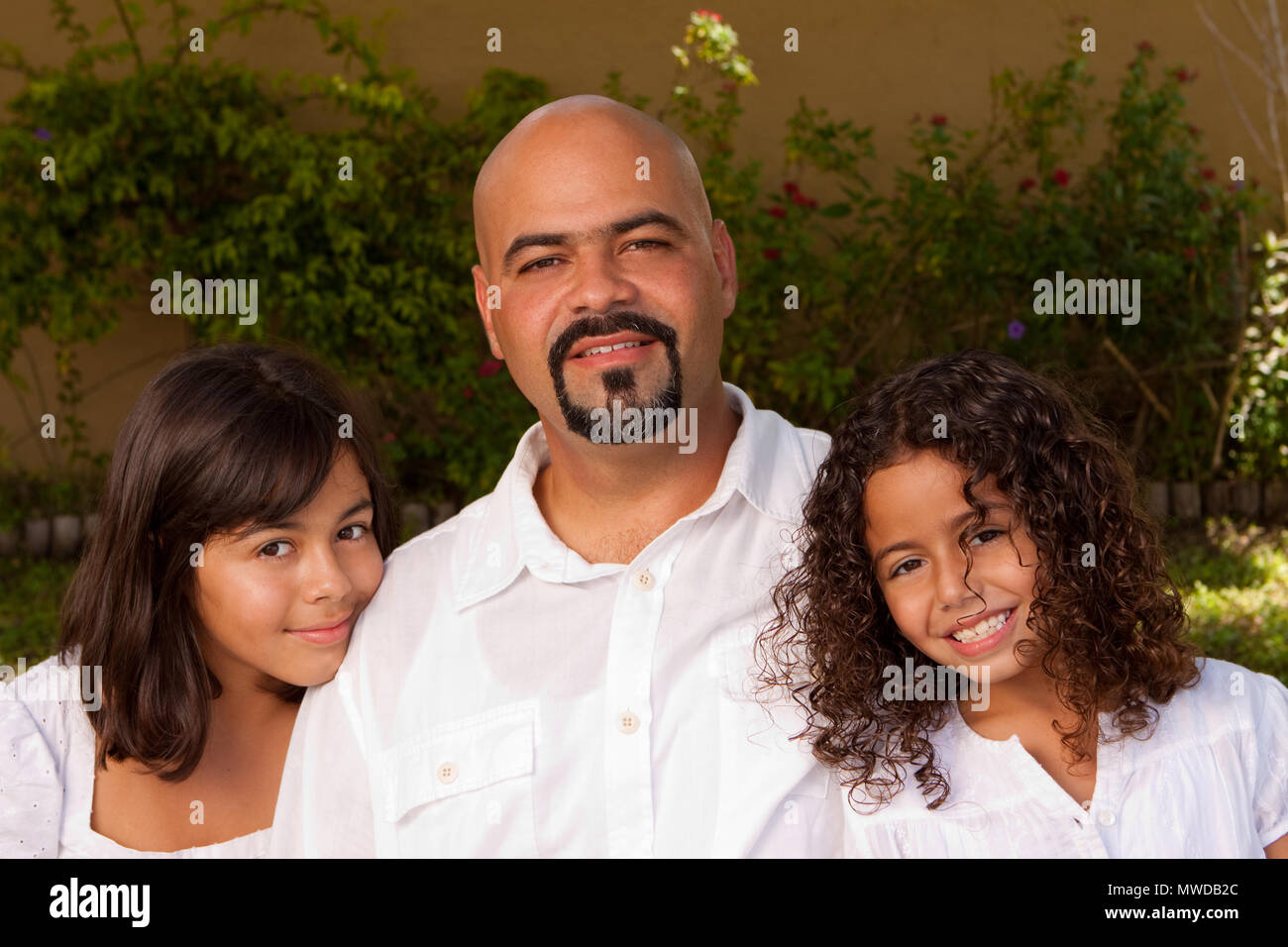 Happy Hispanic family laughing and smiling Stock Photo - Alamy