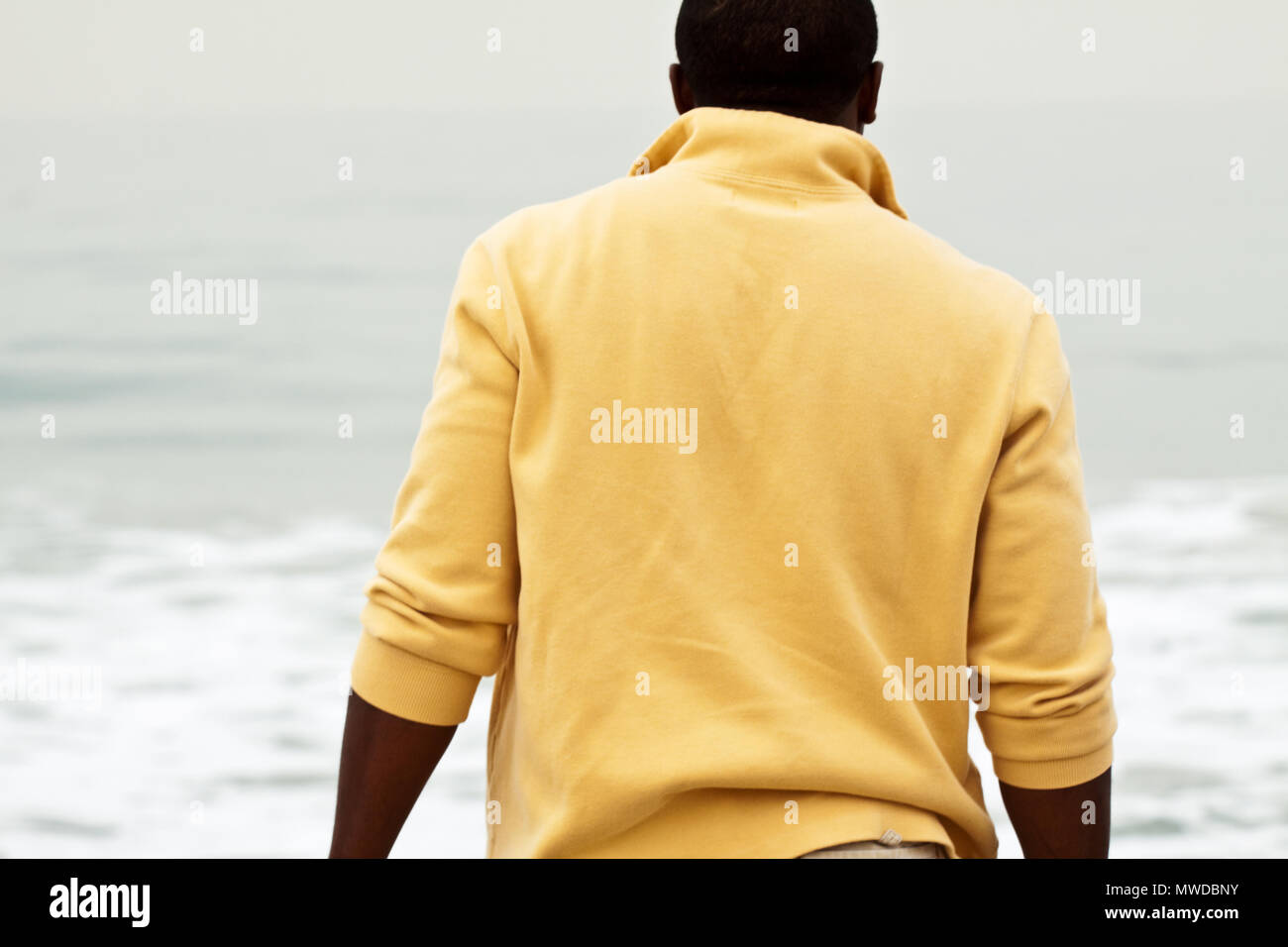 African American man walking on the beach Stock Photo - Alamy