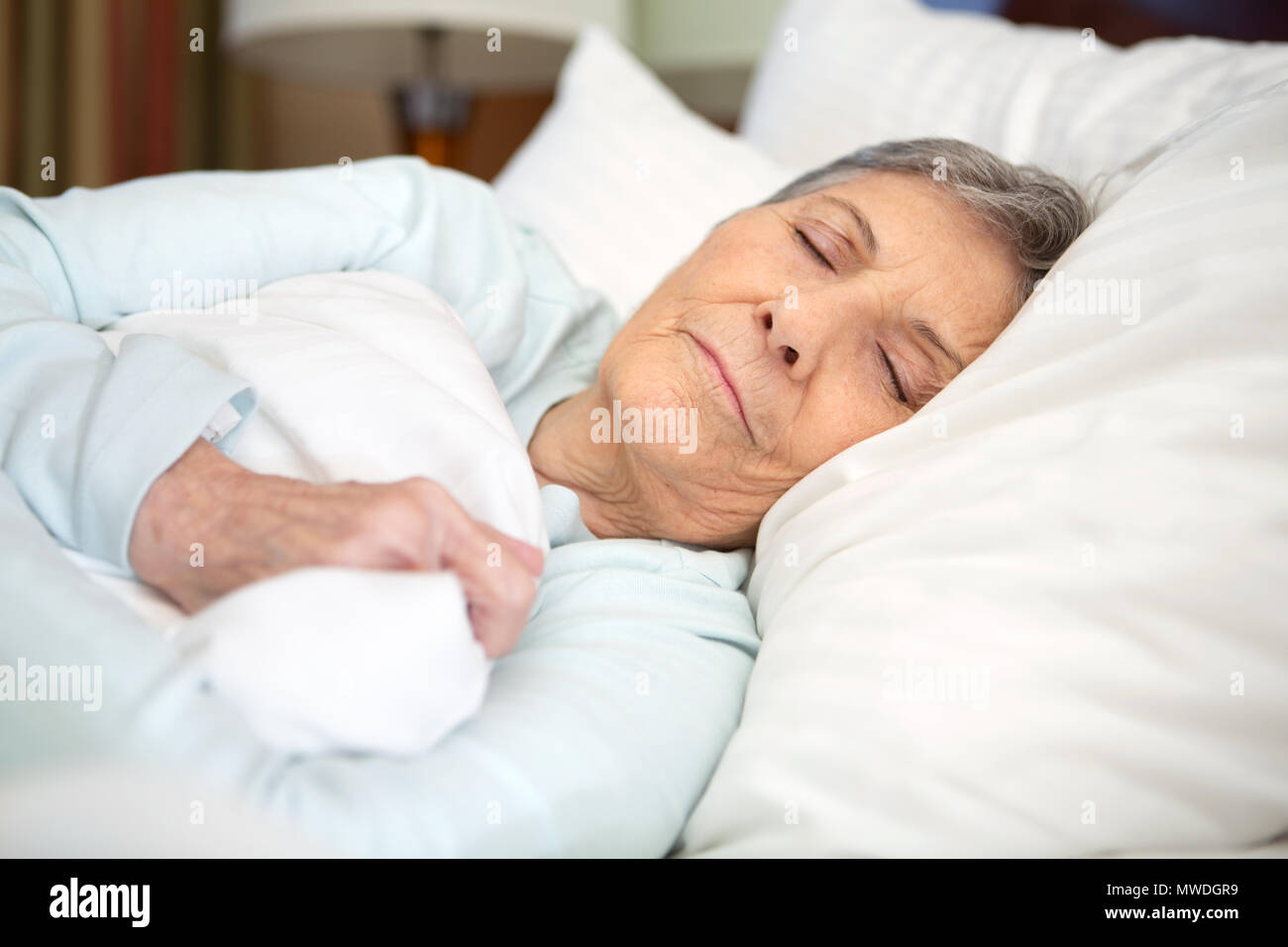 Elderly woman getting a good nights rest Stock Photo Alamy