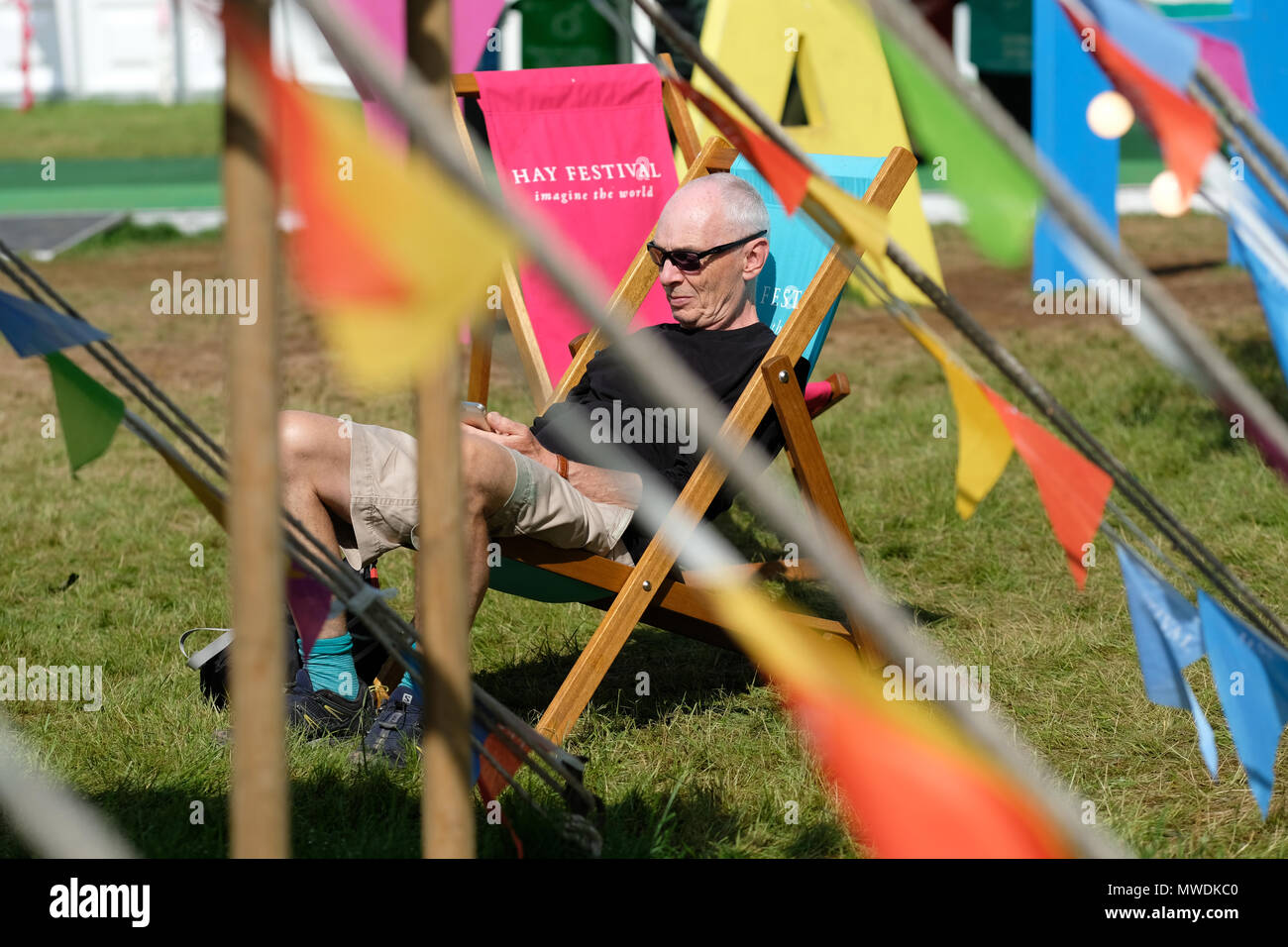 Hay Festival, Hay on Wye, UK - Friday 1st June 2018 - UK Weather - The sun shines onto the Hay Festival lawns this morning on the first day of the meteorological summer - Visitors enjoy the warm sunshine  - Photo Steven May / Alamy Live News Stock Photo