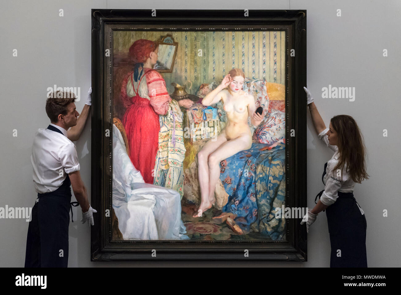 London, UK.  1 June 2018. Sotheby's technicians present 'Toilette', 1913, by Petr Iosifovich Smukrovich (Est. GBP200-300k) at a preview of the Russian Pictures and Russian Works of Art, Fabergé & Icons sale which will take place at Sotheby's, New Bond Street on 5 June.  Credit: Stephen Chung / Alamy Live News Stock Photo