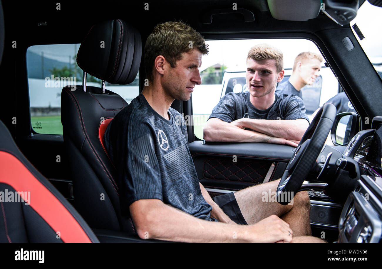 Appiano/Sudtirol. The German national football team with eleven new, branded in the Best Never Rest campaign look Mercedes-AMG G63 Edition 1 models as part of a shoot by DFB General Sponsor Mercedes-Benz in the DFB training camp. Timo Werner (Germany) speaks to Thomas Mueller (Germany) in the Mercedes-AMG G63 Edition 1. Back: Nils Petersen (Germany). GES/football/preparation for the 2018 World Cup, training camp for the German national team in South Tyrol, 31.05.2018 Football/Soccer: Training camp of the German national football team, Eppan, May 31, 2018 | usage worldwide Stock Photo