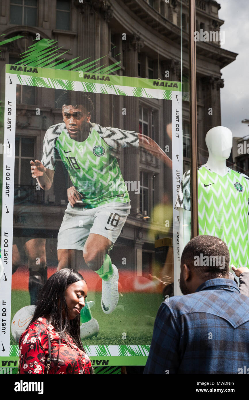 London, UK. 1st June, 2018. Fans of the Super Eagles, the Nigerian national  football team, queue outside Nike's flagship store in Oxford Street to buy  football kits for the forthcoming FIFA 2018
