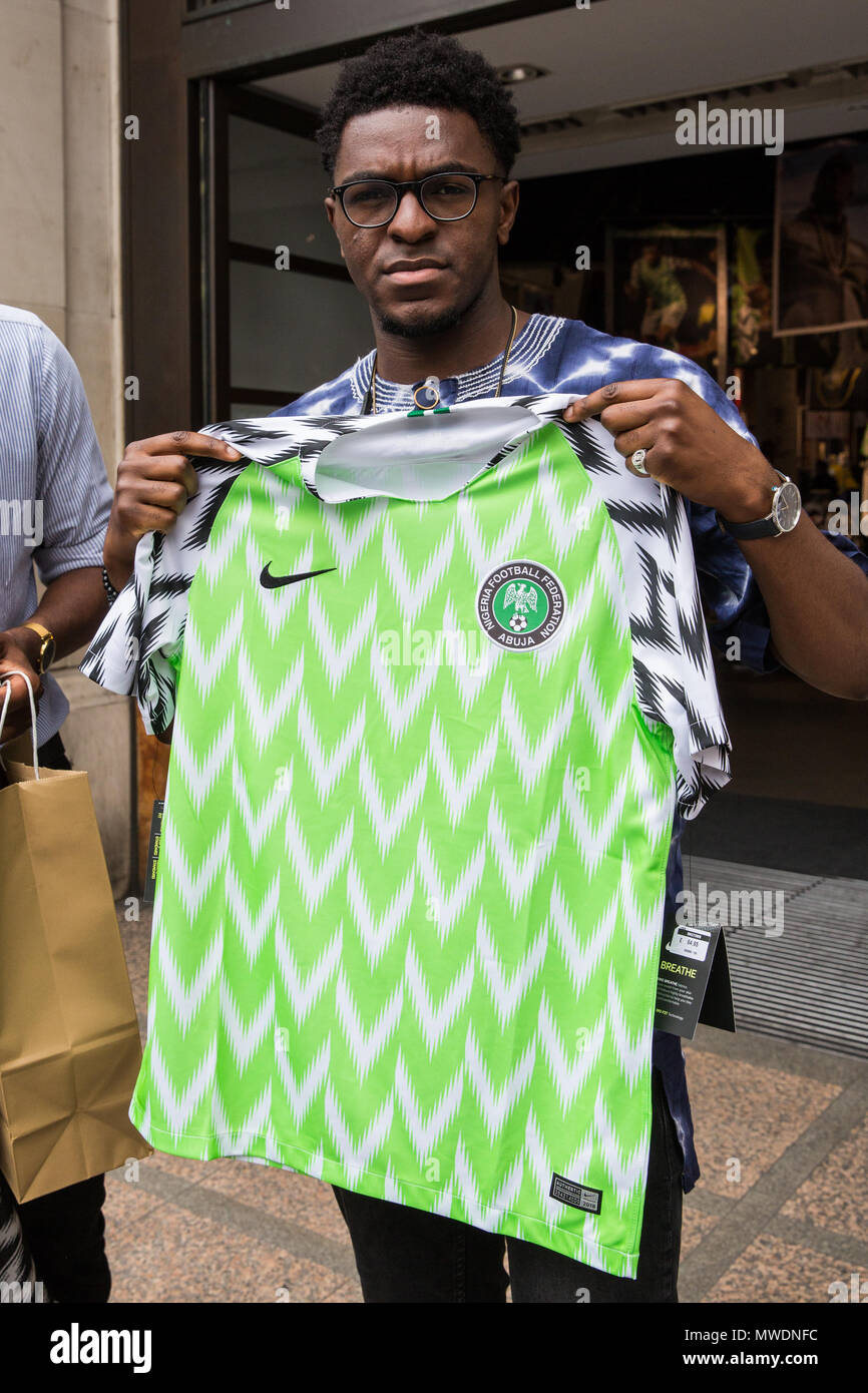 London, UK. 1st June, 2018. Fans of the Super Eagles, the Nigerian national  football team, display newly purchased football kits for the forthcoming  FIFA 2018 World Cup outside Nike's flagship store in