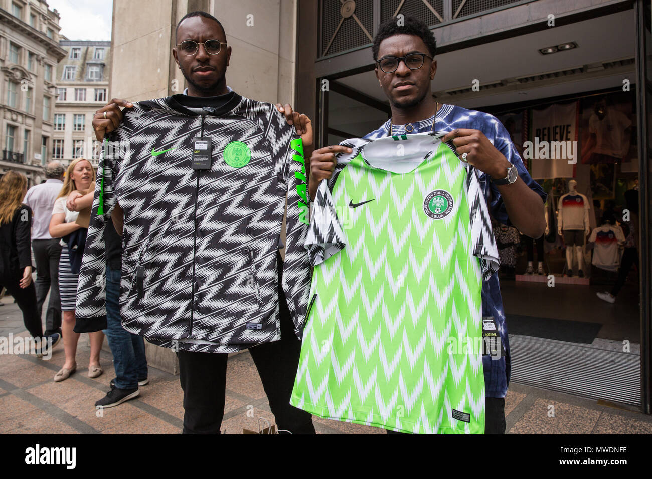 London, UK. 1st June, 2018. Fans of the Super Eagles, the Nigerian national football  team, display newly purchased football kits for the forthcoming FIFA 2018  World Cup outside Nike's flagship store in