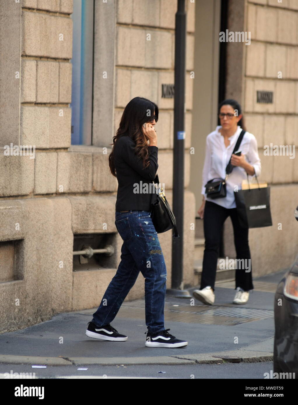 Milan, Sabrina Ferilli walks downtown alone Sabrina Ferilli arrives  downtown alone while talking on a cell phone, then goes shopping Stock  Photo - Alamy