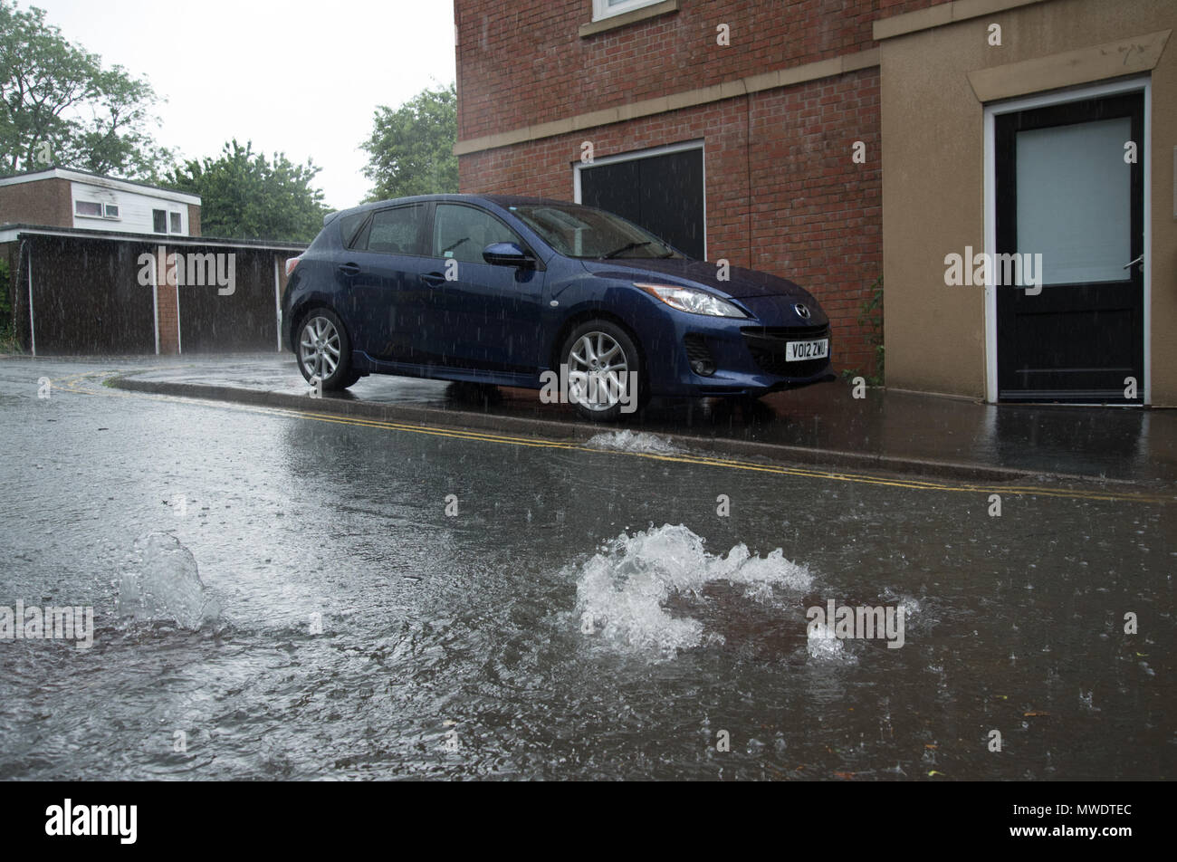 Shrewsbury, Shropshire, UK. 1st June 2018. A car has a lucky escape when it was moved to higher ground, away from the flooded streets and overflowing drains following flash floods in Coleham, close to Shrewsbury town centre and the River Severn. Within minutes, local shops were flooded and the road was eventually sealed off by the fire brigade. Credit: Richard Franklin/Alamy Live News Stock Photo