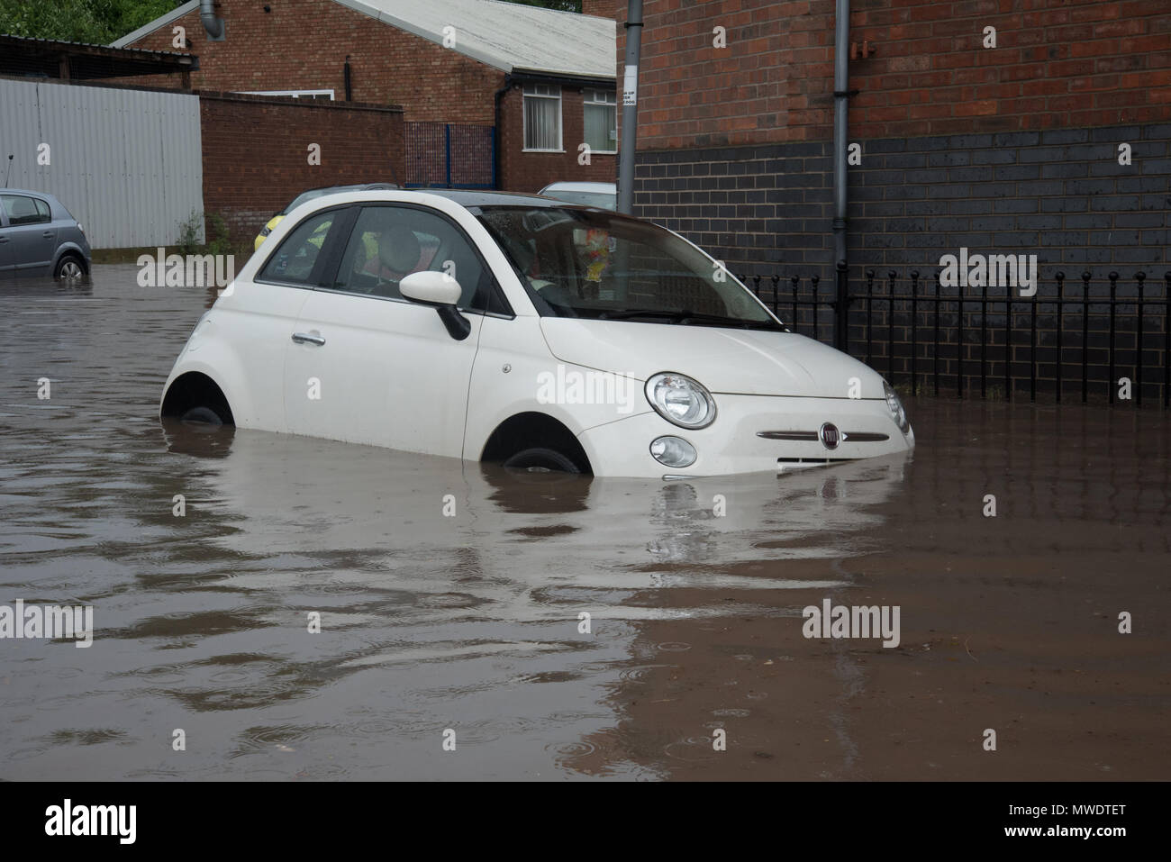 Shrewsbury, Shropshire, UK. 1st June 2018. A car in Coleham Head close to Shrewsbury town centre and the River Severn is submerged following a horrendous flash flood this afternoon. Credit: Richard Franklin/Alamy Live News Stock Photo