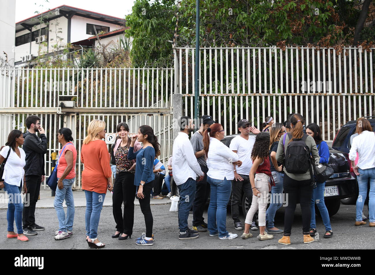 People seen waiting outside the Helicoide Jail for their relatives to be released. The Government of Venezuela grants precautionary measures to political prisoners who were detained at the headquarters of the Bolivarian Intelligence Service (SEBIN). 39 political prisoners were released with precautionary measures by the government of Nicolas Maduro. Still more than 150 people continue behind bars for having participated in protests against the government. Among those released is the former Mayor of San Cristobal, state tachira, Daniel Ceballos; Retired General Angel Vivas and protesters who pa Stock Photo