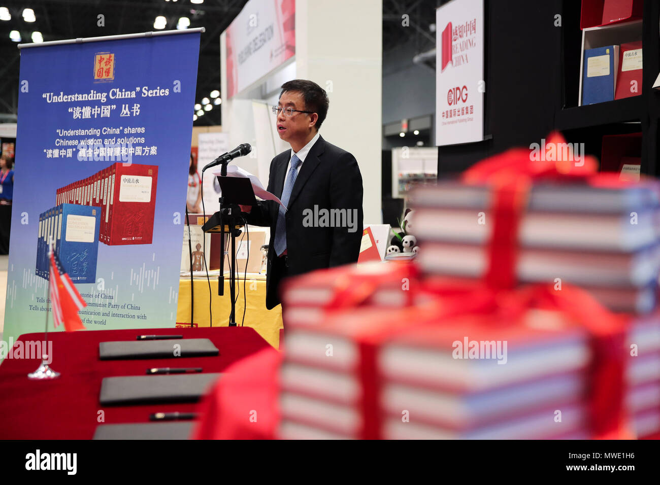 New York, USA. 1st June, 2018. Hu Kaimin, deputy chief editor of China's Foreign Languages Press (FLP), delivers a speech during a book promotion event at the BookExpo America in New York, the United States, June 1, 2018. Understanding China, a book series depicting the country's historic changes in recent decades to international readers, made its debut in the United States at the BookExpo America here on Friday. Credit: Wang Ying/Xinhua/Alamy Live News Stock Photo