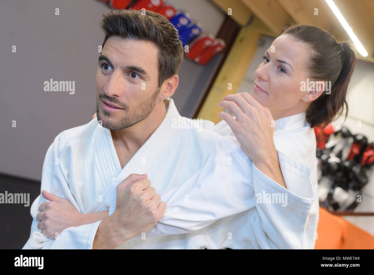 Couple in martial arts hold Stock Photo Alamy