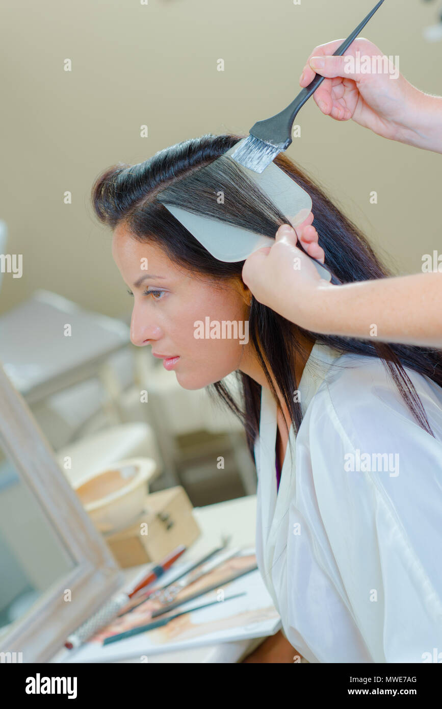 having her hair coloured Stock Photo Alamy