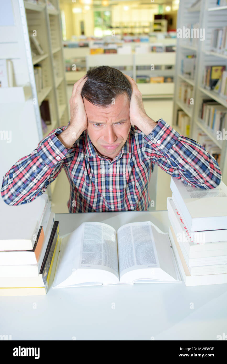 headache cause by reading Stock Photo Alamy