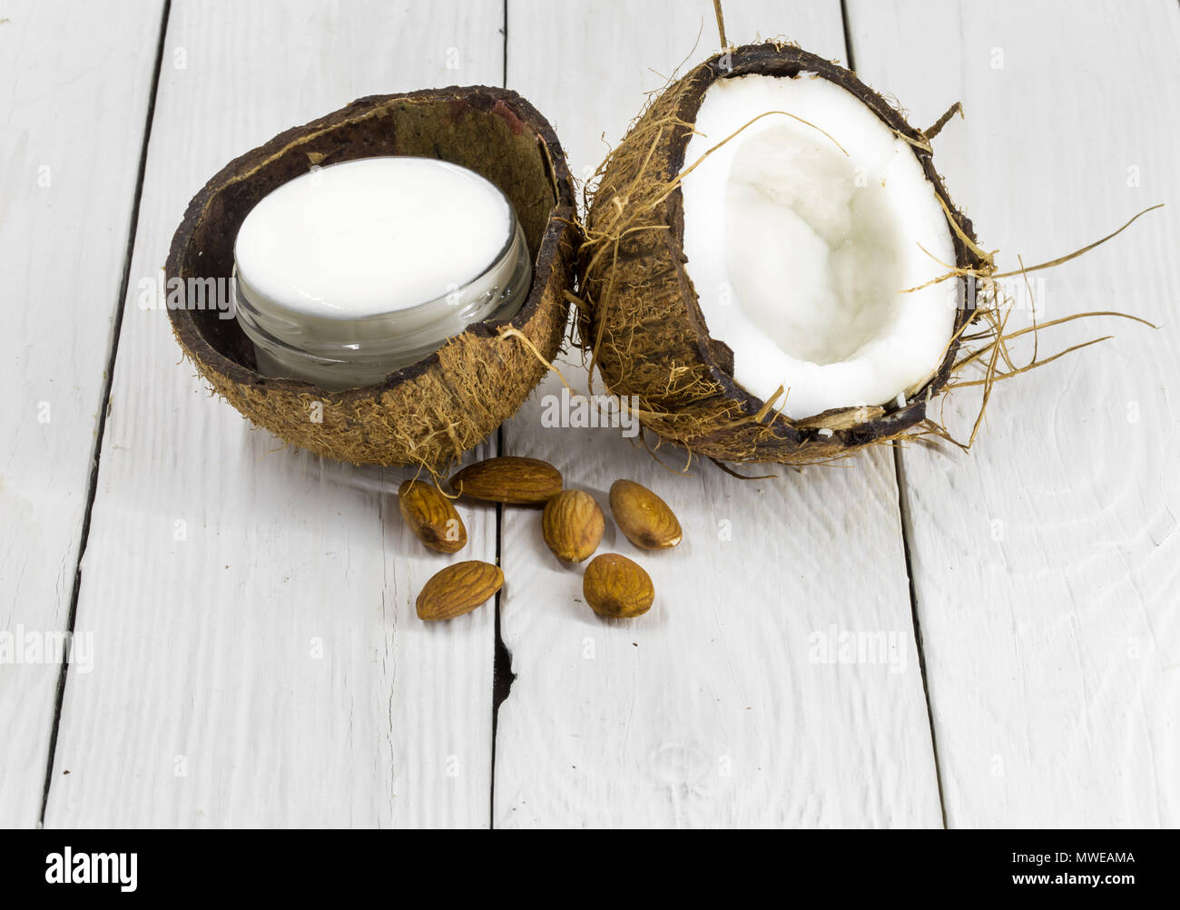 fresh coconut, coconut cream on a wooden white background ...