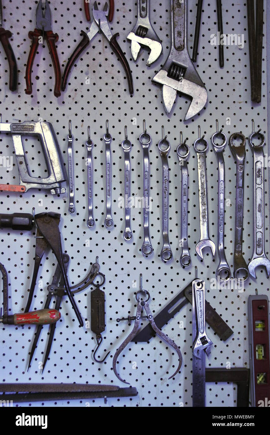 Hand tools and spanners laid out vertically and grouped for easy access