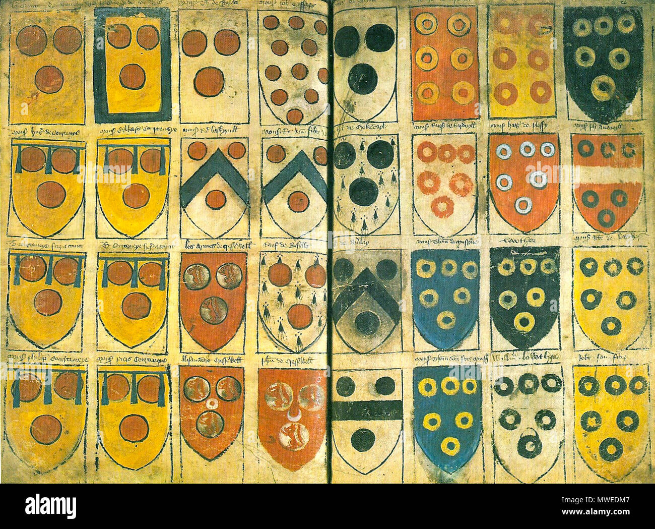 . English: 'Jenyn's Ordinary', c.1360: showing roundels and annulets, the latter including arms of Westmoreland families composed of annulets derived form their Vipont overlords, whose arms are shown on a banner rather than a shield Arms. The left-most two columns show the arms of Courtenay, Earls of Devon and junior branches. The manuscript is now dated to c.1360, with additions made in c.1380: see Fox, Paul A. (2009). 'Fourteenth-century ordinaries of arms: Part 2: William Jenyns' Ordinary'. Coat of Arms 5: 55–64. circa 1360. Jenyn 314 Jenyn's Ordinary circa 1360 Stock Photo