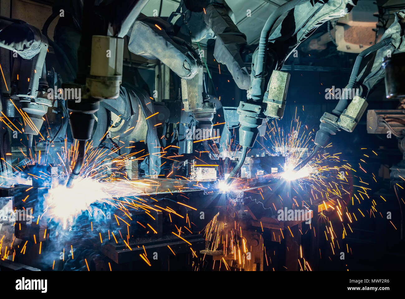 Robots welding in a car factory. Welding car body Stock Photo