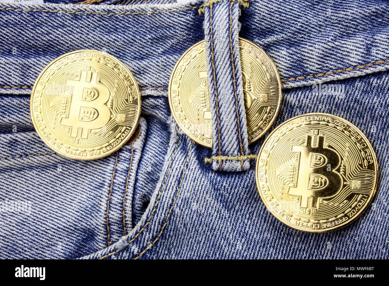 Three Golden Bitcoins On The Jeans Pants Making Online Money - 