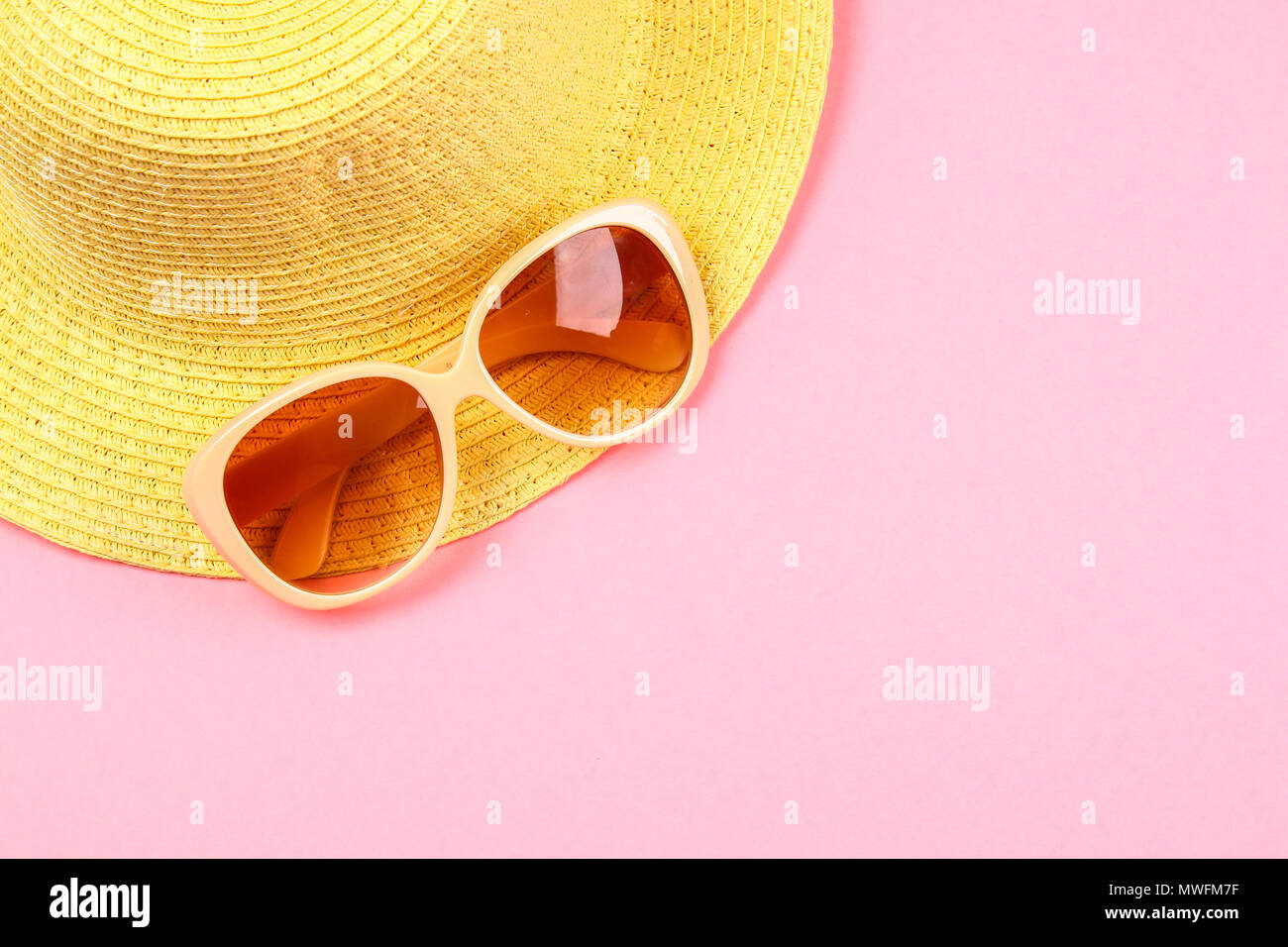 Hat, sunglasses on a pastel pink, purple background Stock Photo - Alamy