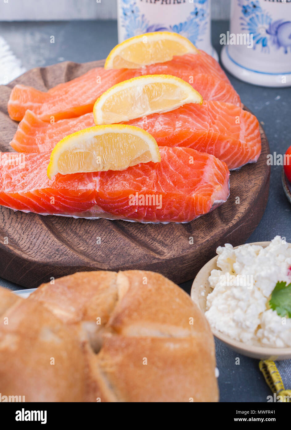 Salmon fillet with lemon, ingredients for cooking dinner. Stock Photo