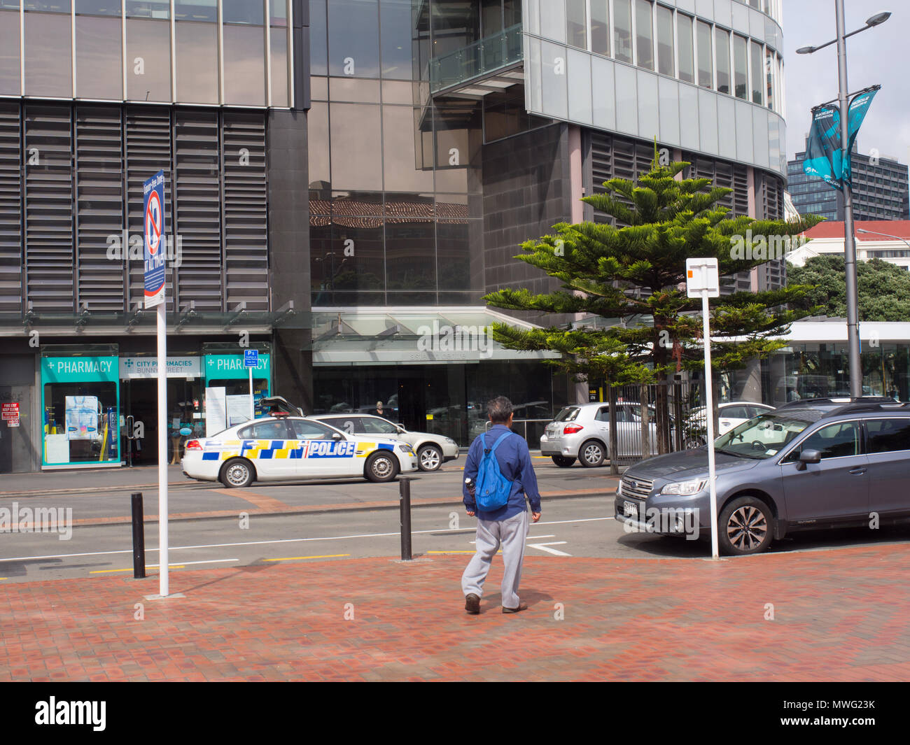 Police Car And A Pedestrian In Wellington Stock Photo
