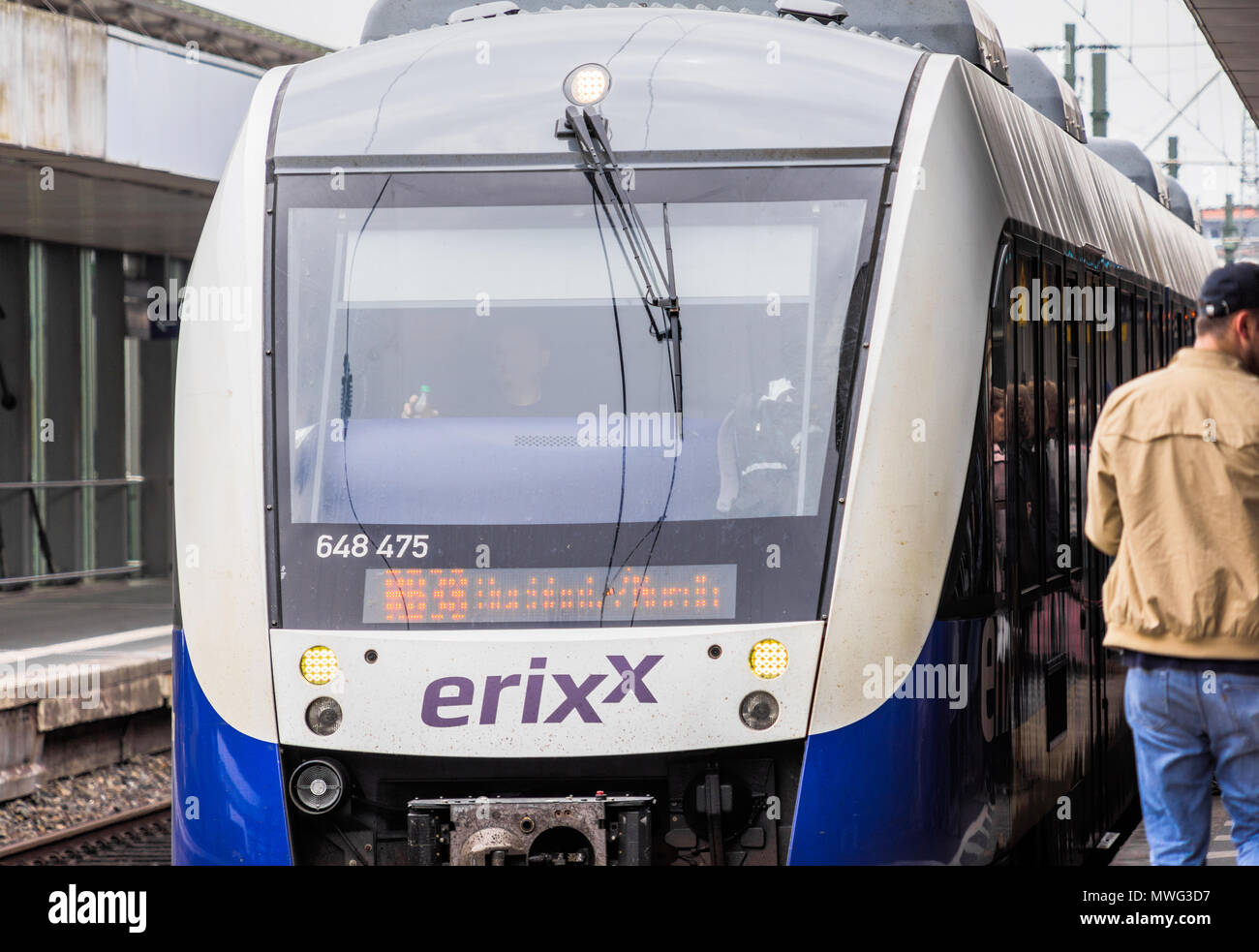 Close-up of a local public transport train arriving at a German railway station, Hanover, Germany, May 2018 Stock Photo