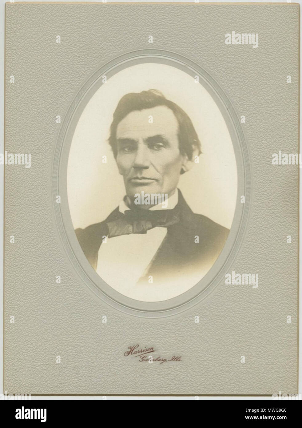 .  English: Silver print cabinet card of Abraham Lincoln's October 11, 1858 sitting. .  English: This is a silver print cabinet card, the original being a Half-plate ambrotype taken by William Judkins Thompson of Monmouth, IL on October 11, 1858. En-route to Quincy, Lincoln stopped in Monmouth, this portrait taken two days before the sixth debate with Stephen Douglas in Quincy. Just before the ambrotype was made, Lincoln gave a three-hour speech to an enthusiastic crowd. The lean, picturesque lawyer from the backwoods was now a national figure. A rare study, the original ambrotype is in the Na Stock Photo