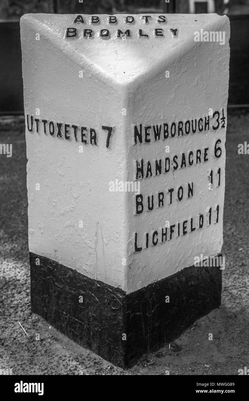 A milestone in the village of Abbots Bromley, Staffordshire. Stock Photo