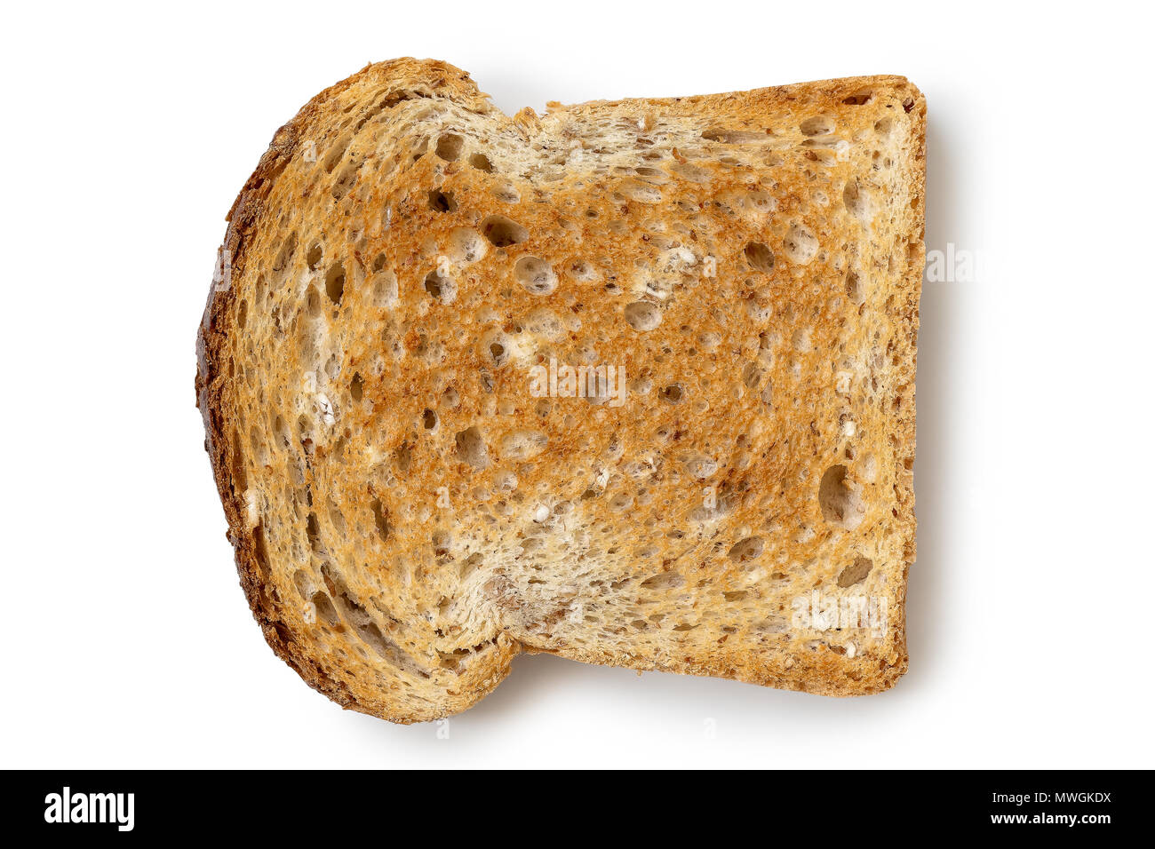 A single slice of whole wheat toast isolated on white from above Stock