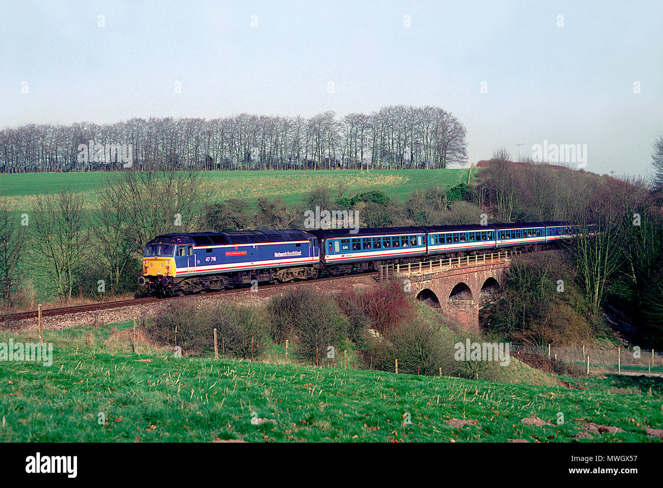 A class 47 diesel locomotive number 47716 working a well patronised 'Network Express' West of England service at Barford St Martin on the 20th March 1993. Stock Photo