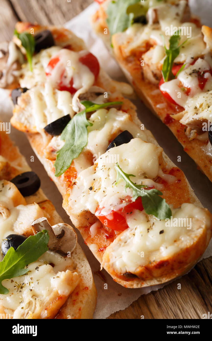 Hot sandwich casserole pizza with chicken, mozzarella cheese, tomatoes